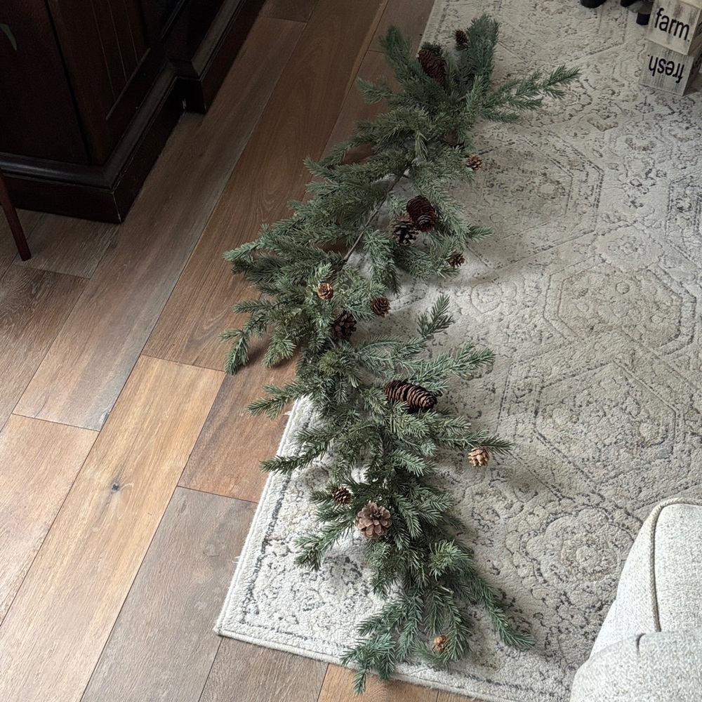 Festive Green Pine Garland with Pinecones 5ft 5ft but with stem it’s closer to 6
